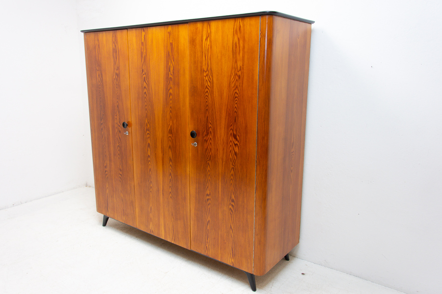 A double-wide mid-century style wardrobe.