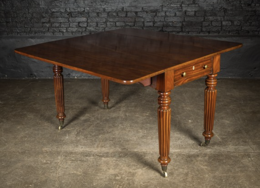Antique table with fluted legs