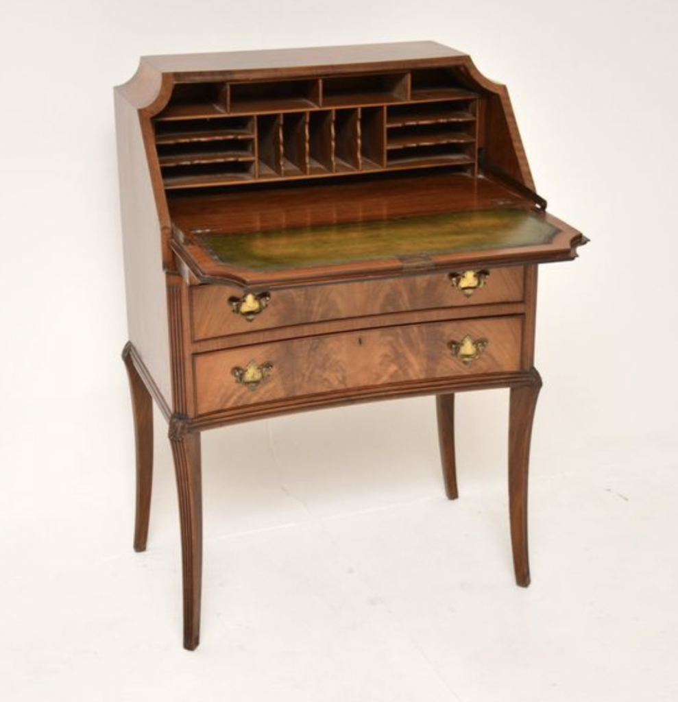 Antique mahogany bureau with sabre legs